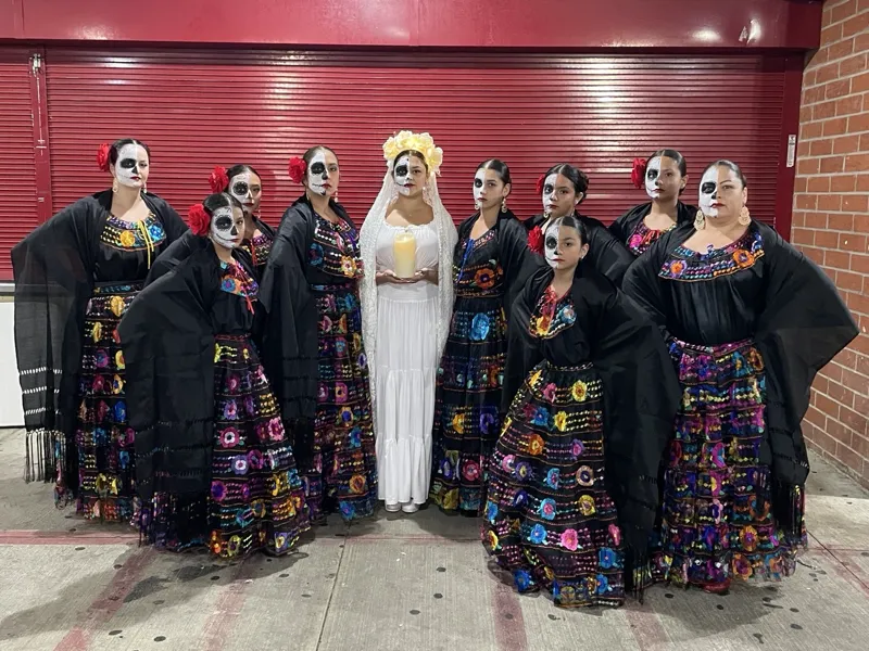 Folklorico group portrait in colorful traditional Mexican folk dance costumes