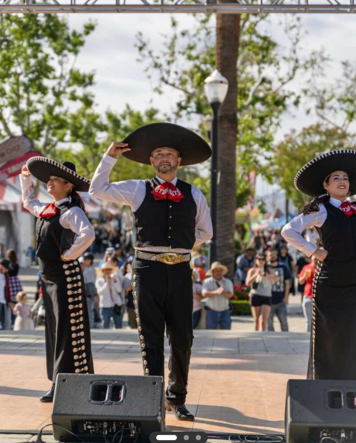 Ballet Folklórico Mi Herencia performing in mariachi attire